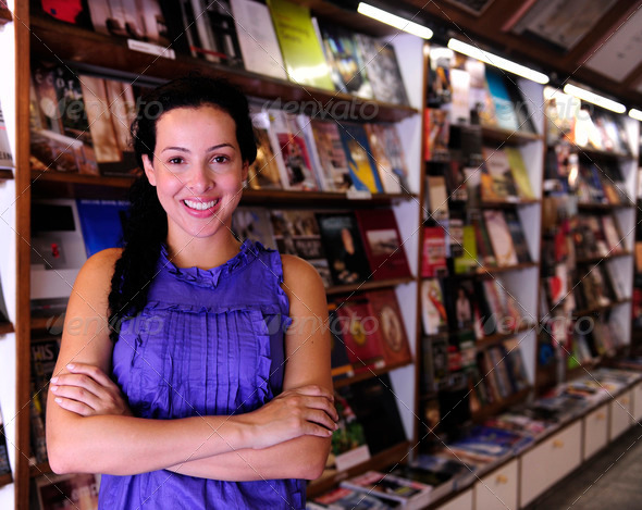 small business: happy owner of a bookstore
