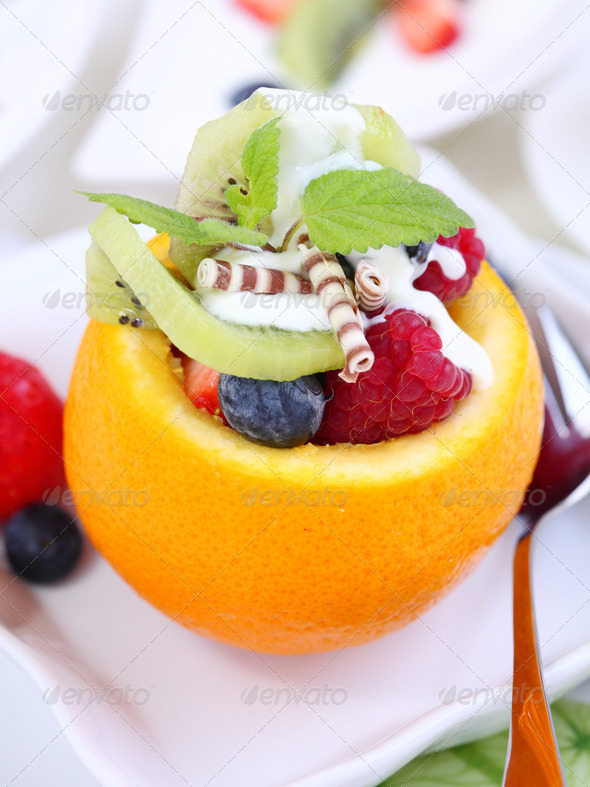 Low calorie dessert – orange filled with fruits