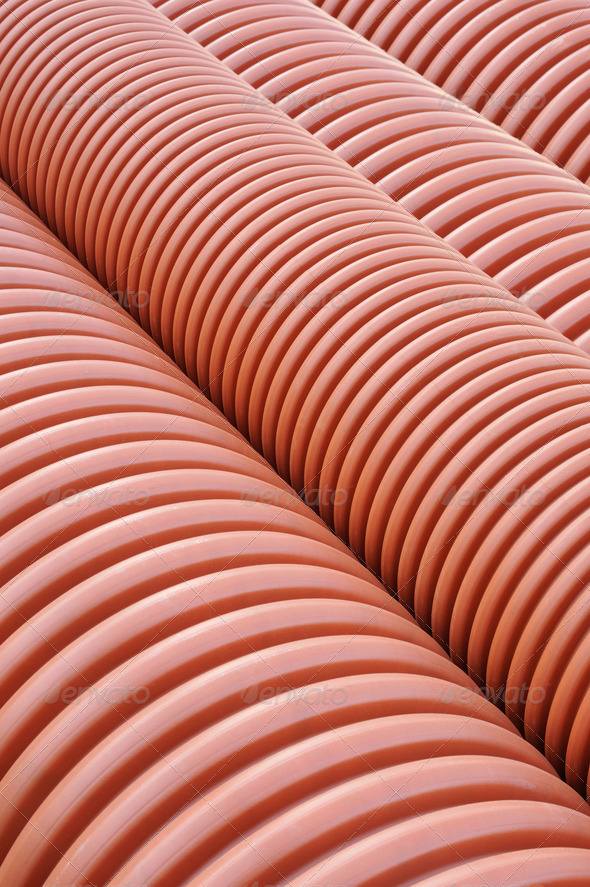 Plastic drainage pipes stacked - sewage conduit - background