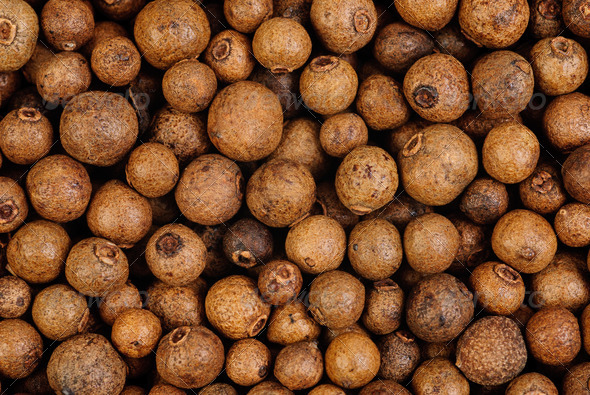 Background texture of whole allspice(jamaica pepper) .