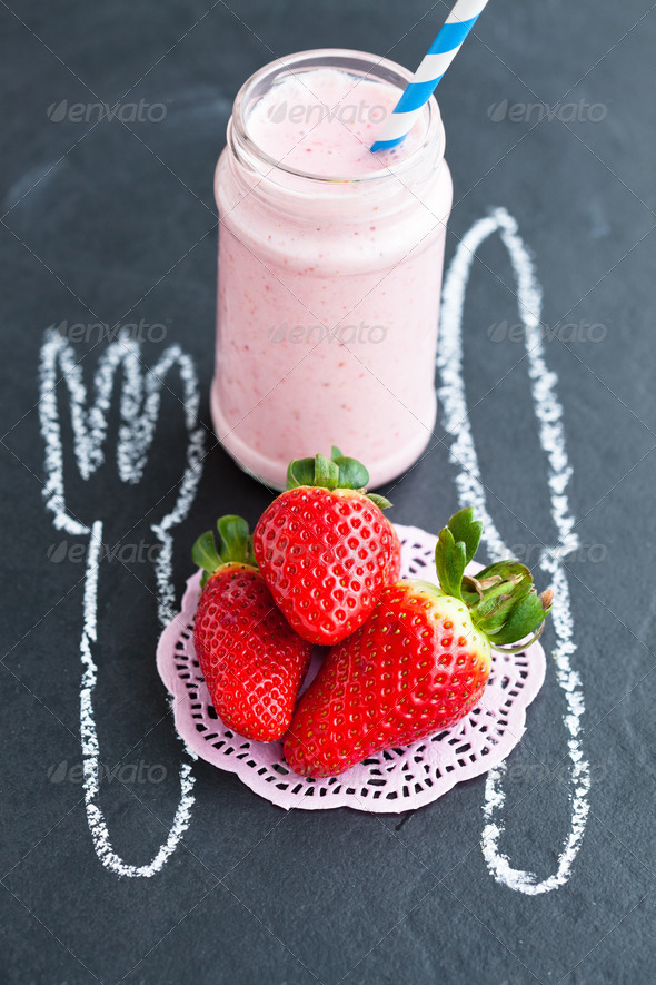 Fresh whole strawberries and smoothie