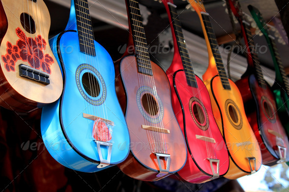 bright colorful guitars for sale at a street shop in San Diego, California