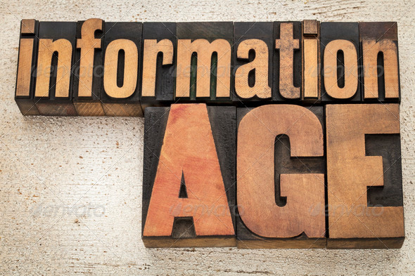 information age in vintage letterpress wood type on a grunge painted barn wood background
