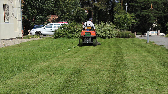 VideoHive Gardener Mowing the Lawn 5536611