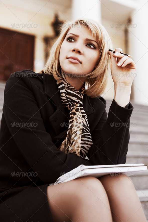 Young businesswoman with notebook - Stock Photo - Images