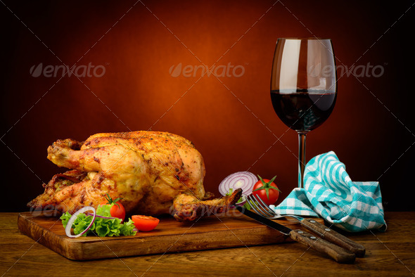 still life with traditional roasted chicken and red wine