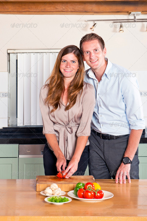 Work – Life Balance Concept: Couple cooking dinner together after work