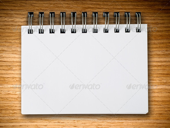 White notebook on oak wood