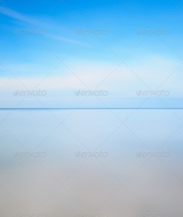 Long exposure photography. Horizon line, soft sea and blue sky