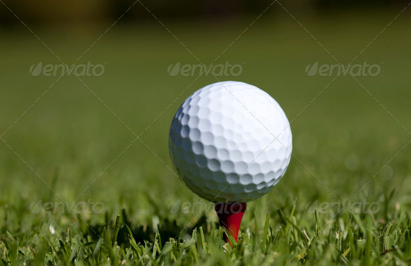 Golfball close up on red tee